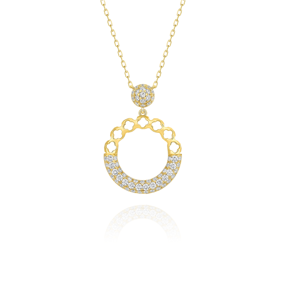 Gold necklace with a circular pendant on a white background