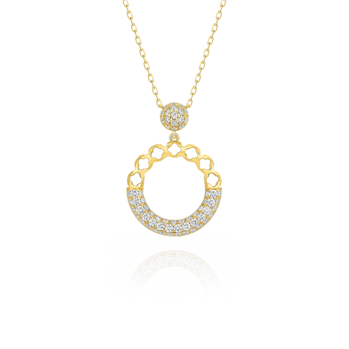Gold necklace with a circular pendant on a white background
