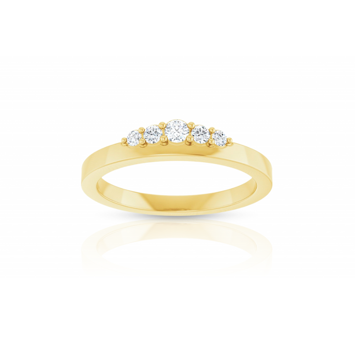 Gold ring with five diamonds on a white background
